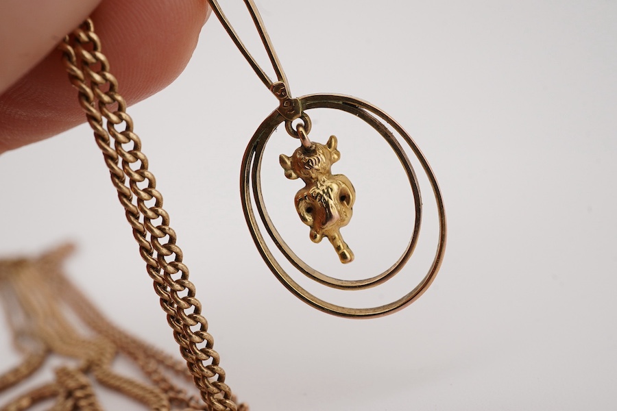 A 14k chain, 40cm, with a 9ct 'Imp' drop pendant, 47mm, together with a 9ct chain and a 9ct cross pendant on a yellow metal chain. Condition - poor to fair